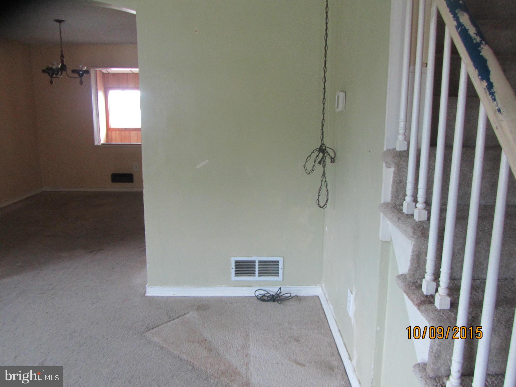 3227 Vulcan Road Baltimore, MD 21222 - Photo 4 of 17 a view of a hallway with a window