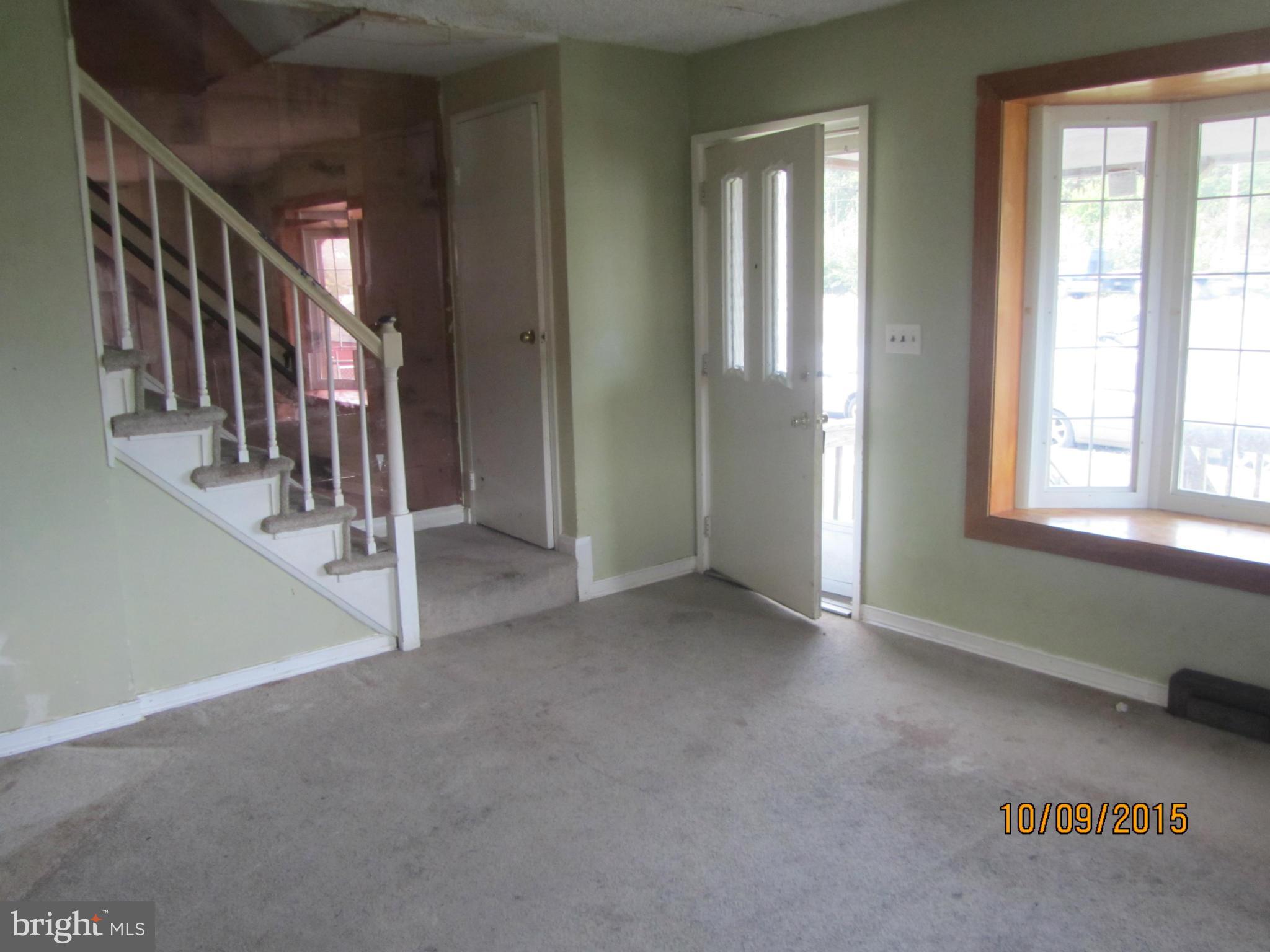 3227 Vulcan Road Baltimore, MD 21222 - Photo 7 of 17 a view of an empty room with stairs