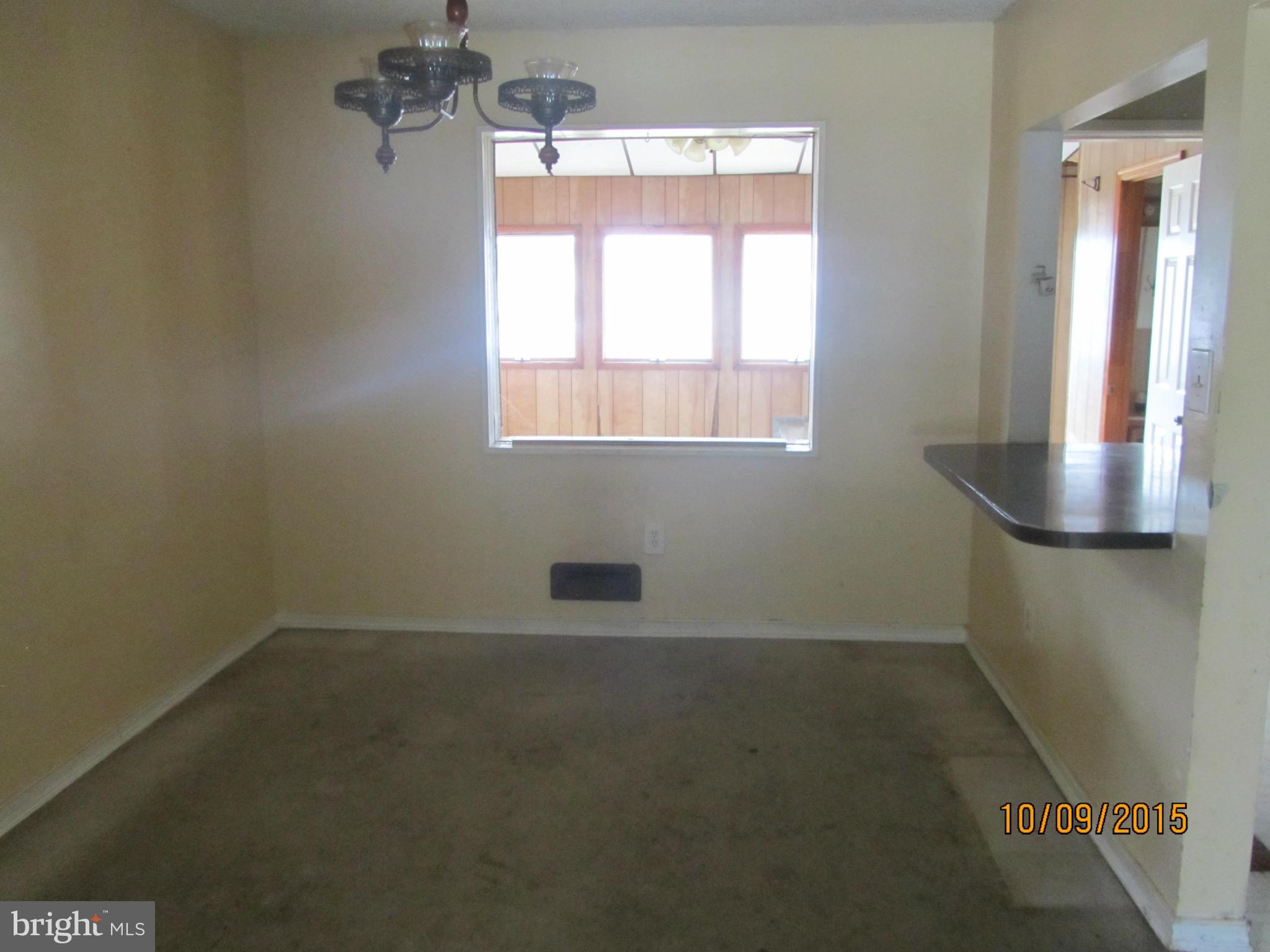 3227 Vulcan Road Baltimore, MD 21222 - Photo 8 of 17 a view of a room that has a window in it