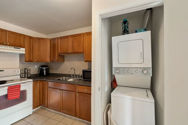 a utility room with sink dryer and washer