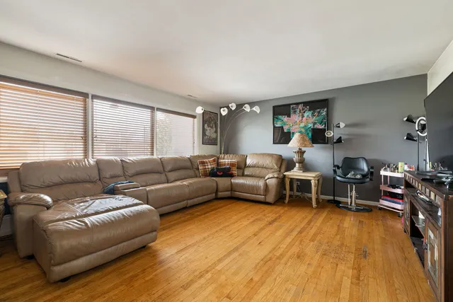 a kitchen with a sink a refrigerator and cabinets