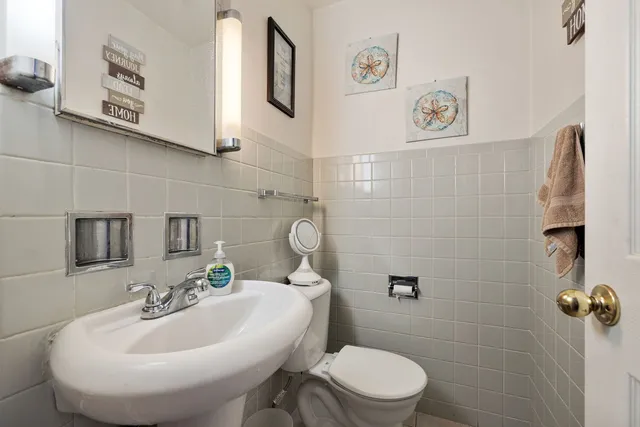 a bed room with furniture and a chandelier