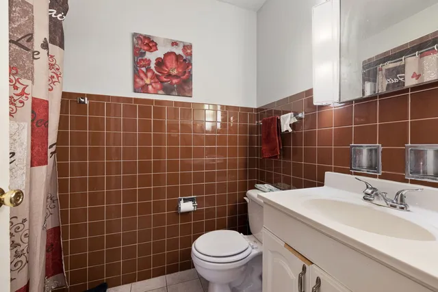 a building with glass top table and chairs