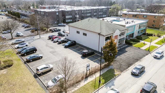 an aerial view of a house with outdoor space