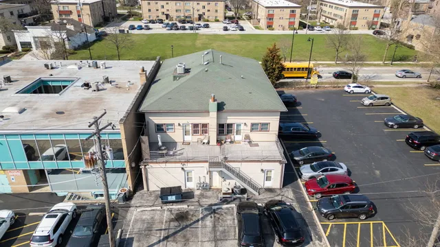 an aerial view of a house with a garden