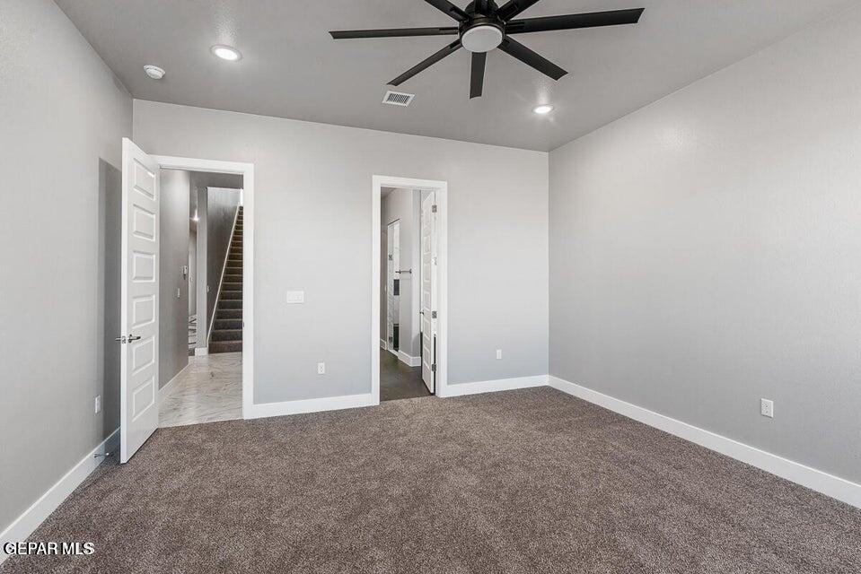 7353 Cimarron Rim Road El Paso, TX 79911 - Photo 13 of 30 wooden floor in an empty room
