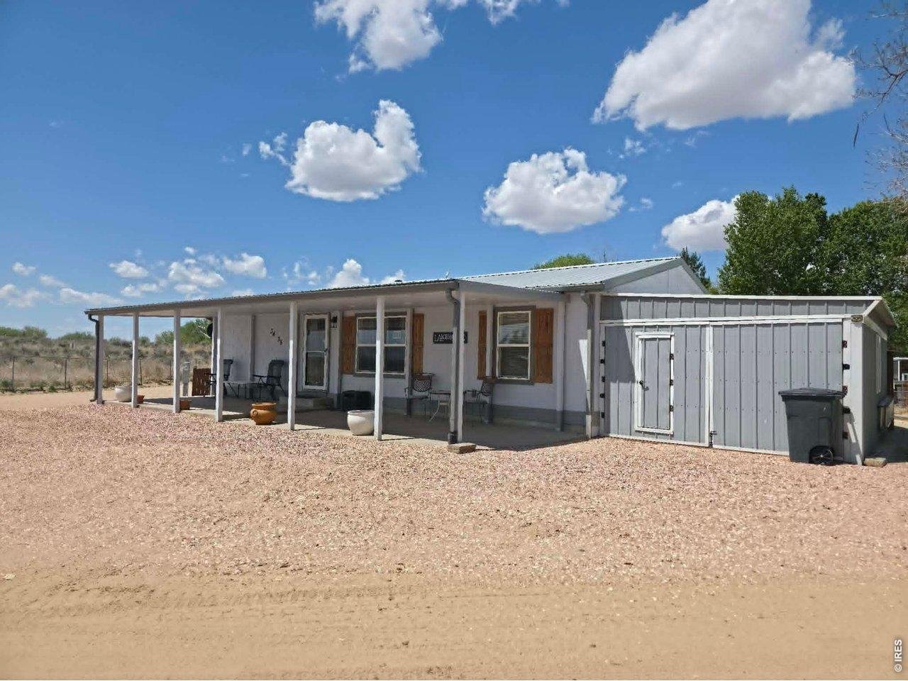 34 Arapaho Road Weldona, CO 80653 - Photo 1 of 48 Front of home facing East