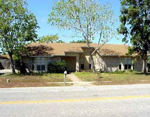 a view of a house with a iron fence