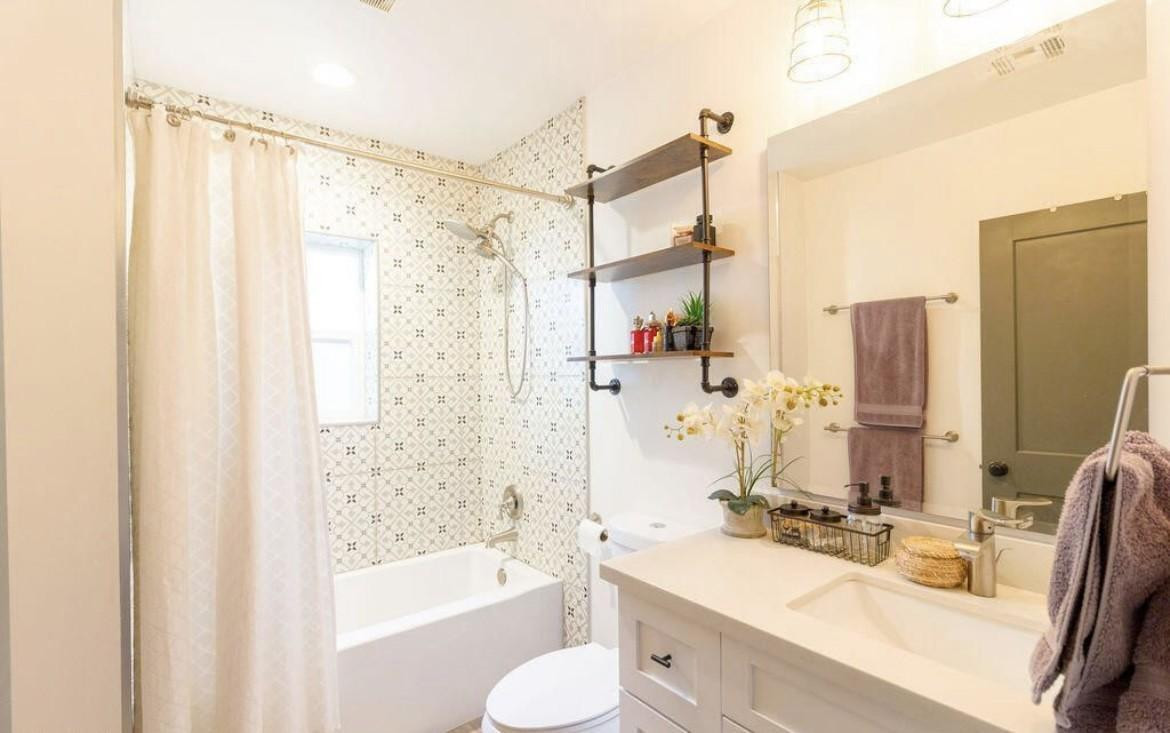 4214 North 20th Street Phoenix, AZ 85016 - Photo 21 of 40 a bathroom with a sink and a mirror