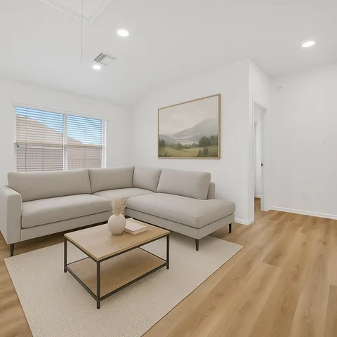 a living room with furniture and a rug