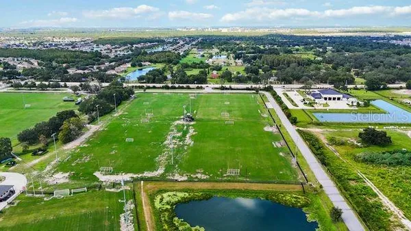 a bed room with a bed and a chair