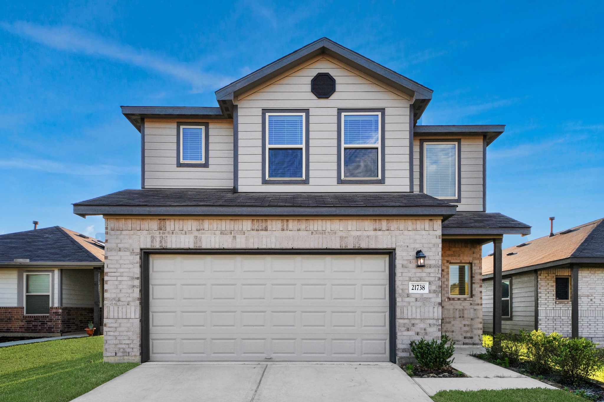 Two-story home situated on an interior lot within a quiet residential neighborhood, featuring a functional layout and a two-car garage.