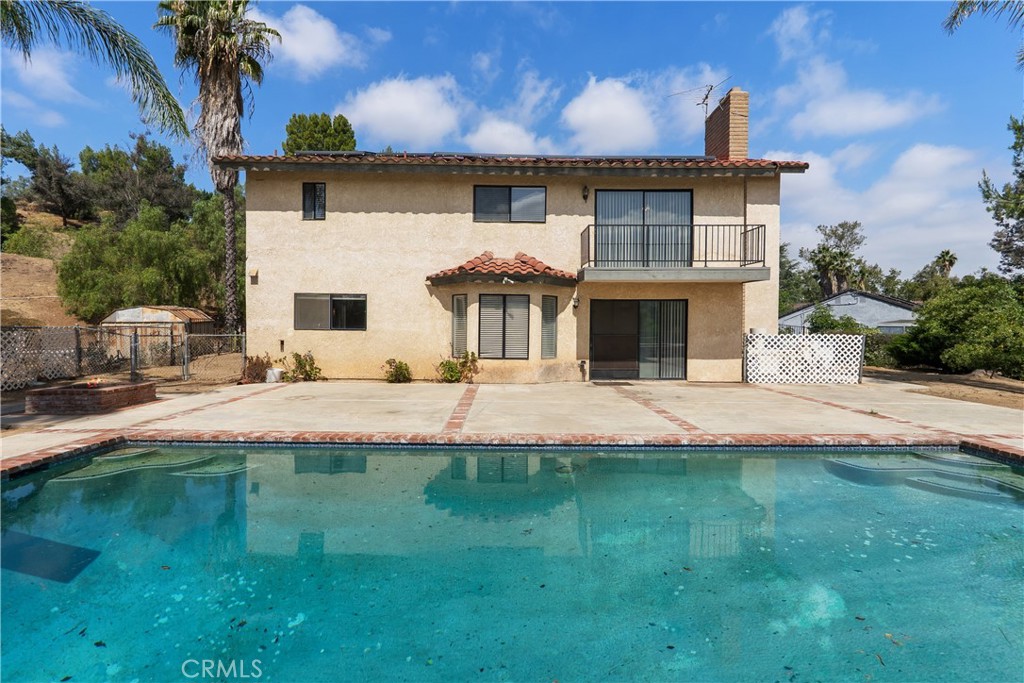 17656 Mockingbird Hill Circle Riverside, CA 92504 - Photo 28 of 49 a front view of a house with a yard
