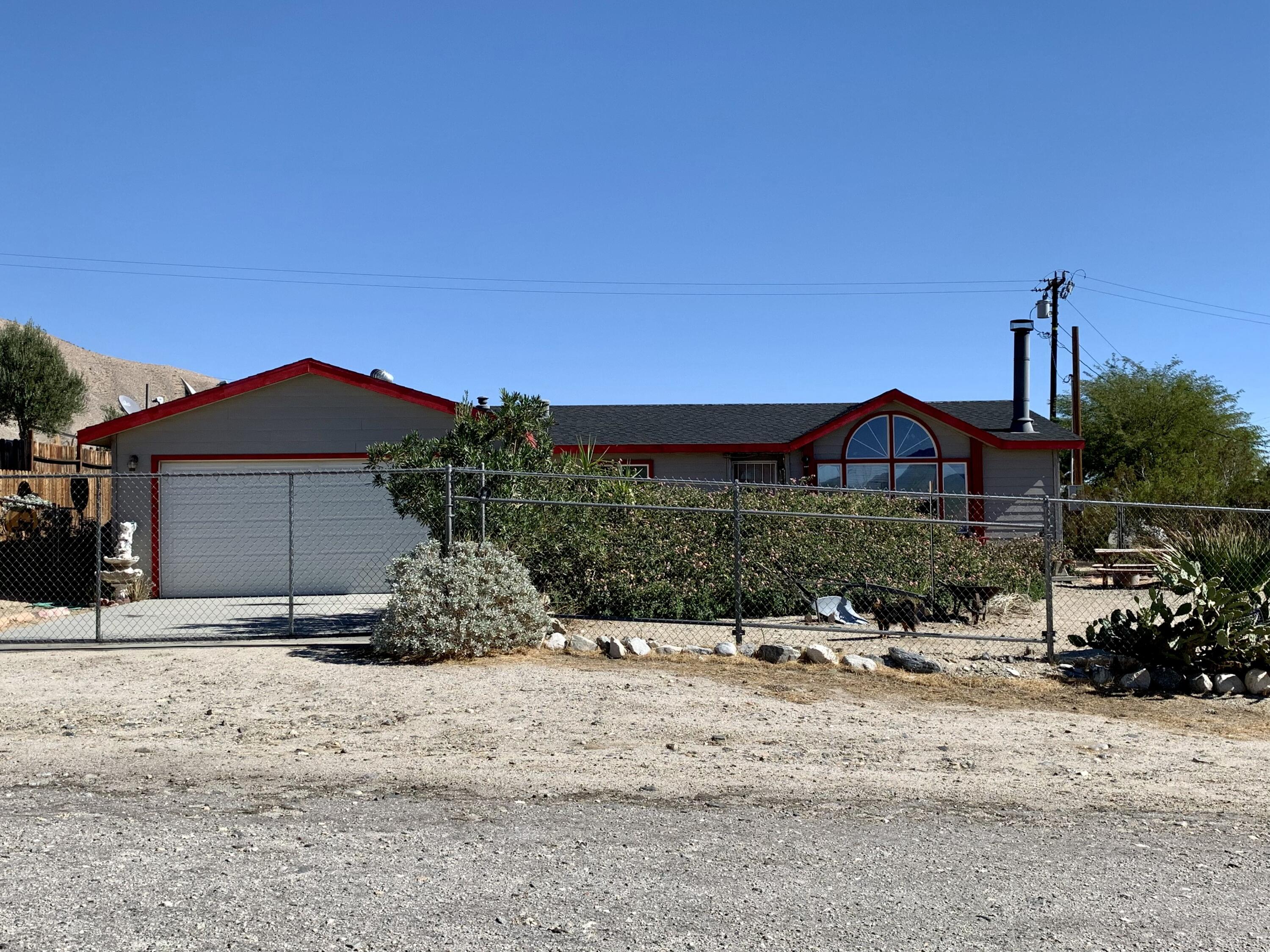 13310 Joshua Road Whitewater, CA 92282 - Photo 1 of 26 a front view of a house with a yard