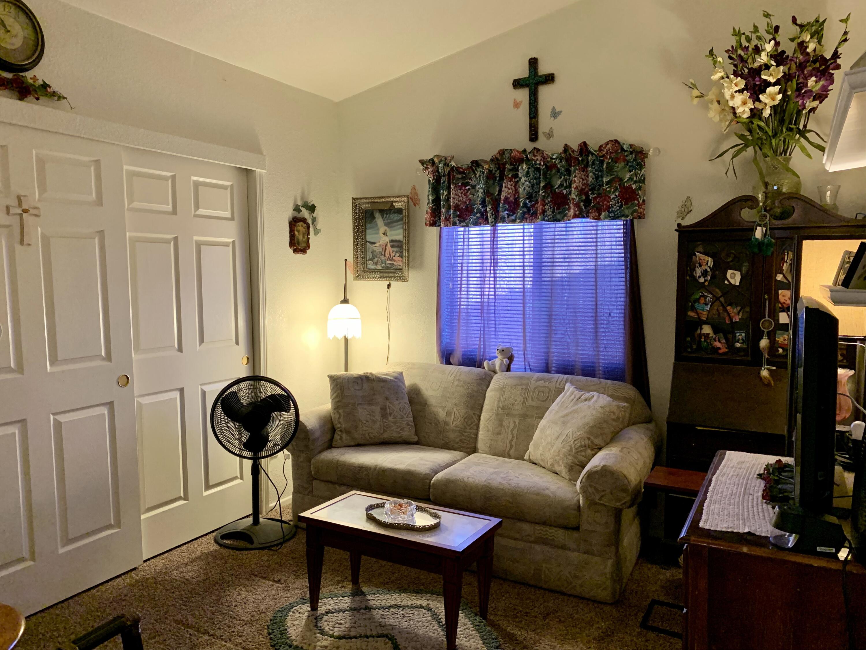 13310 Joshua Road Whitewater, CA 92282 - Photo 11 of 26 a living room with furniture a couch and a chandelier