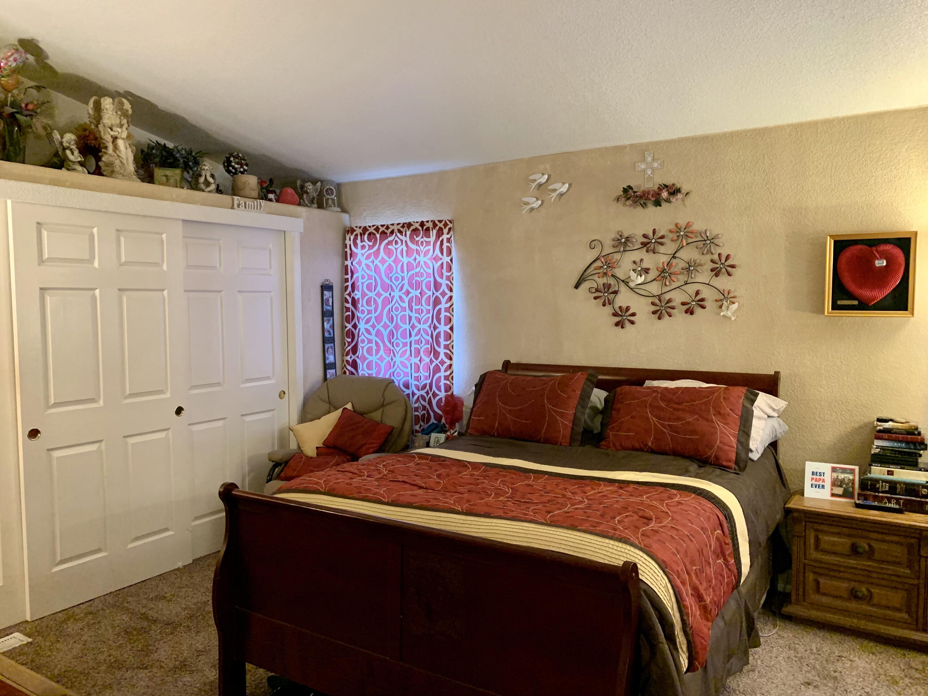 13310 Joshua Road Whitewater, CA 92282 - Photo 12 of 26 a bedroom with a bed and cabinets