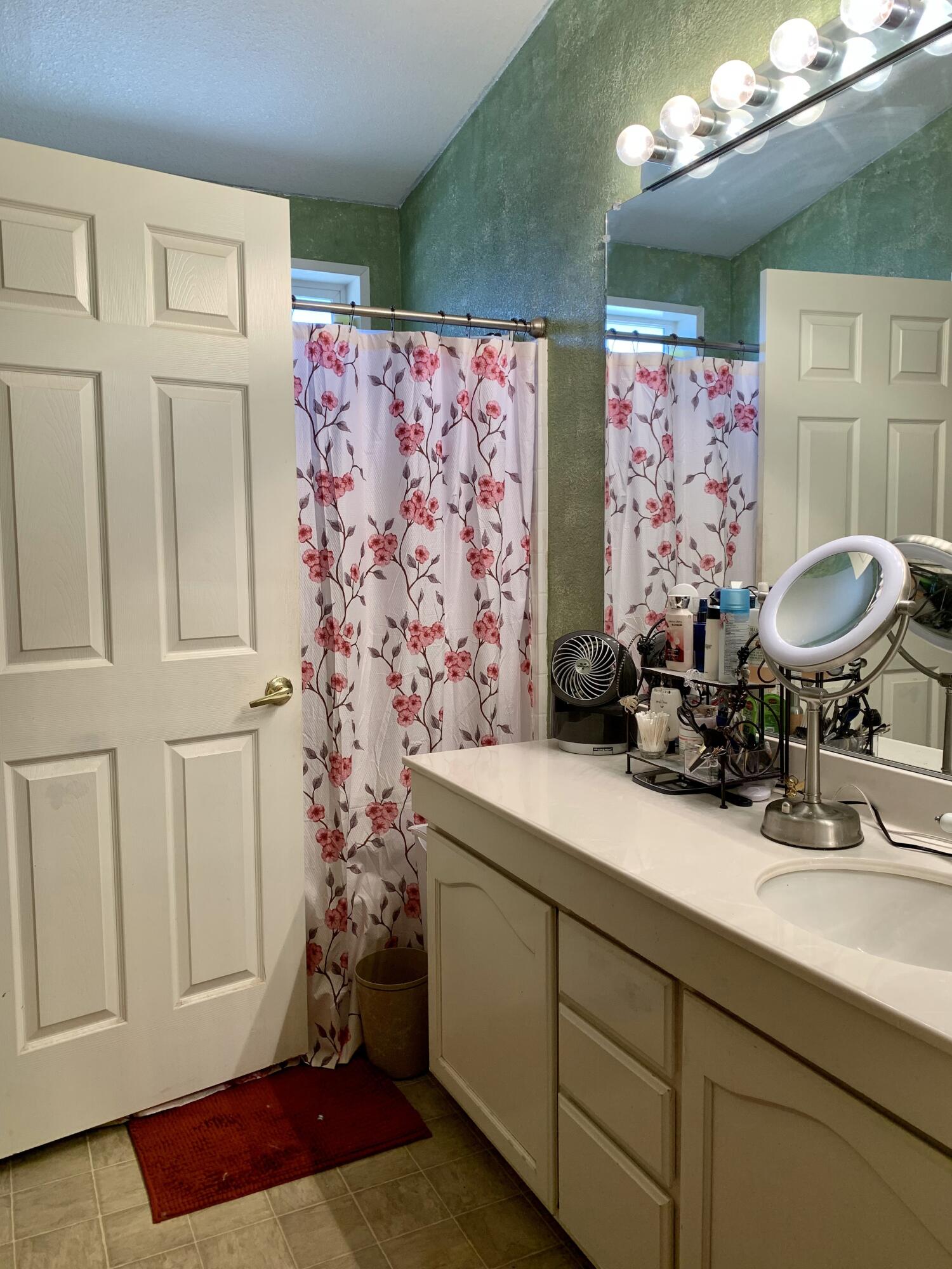 13310 Joshua Road Whitewater, CA 92282 - Photo 14 of 26 a bathroom with a sink mirror and vanity