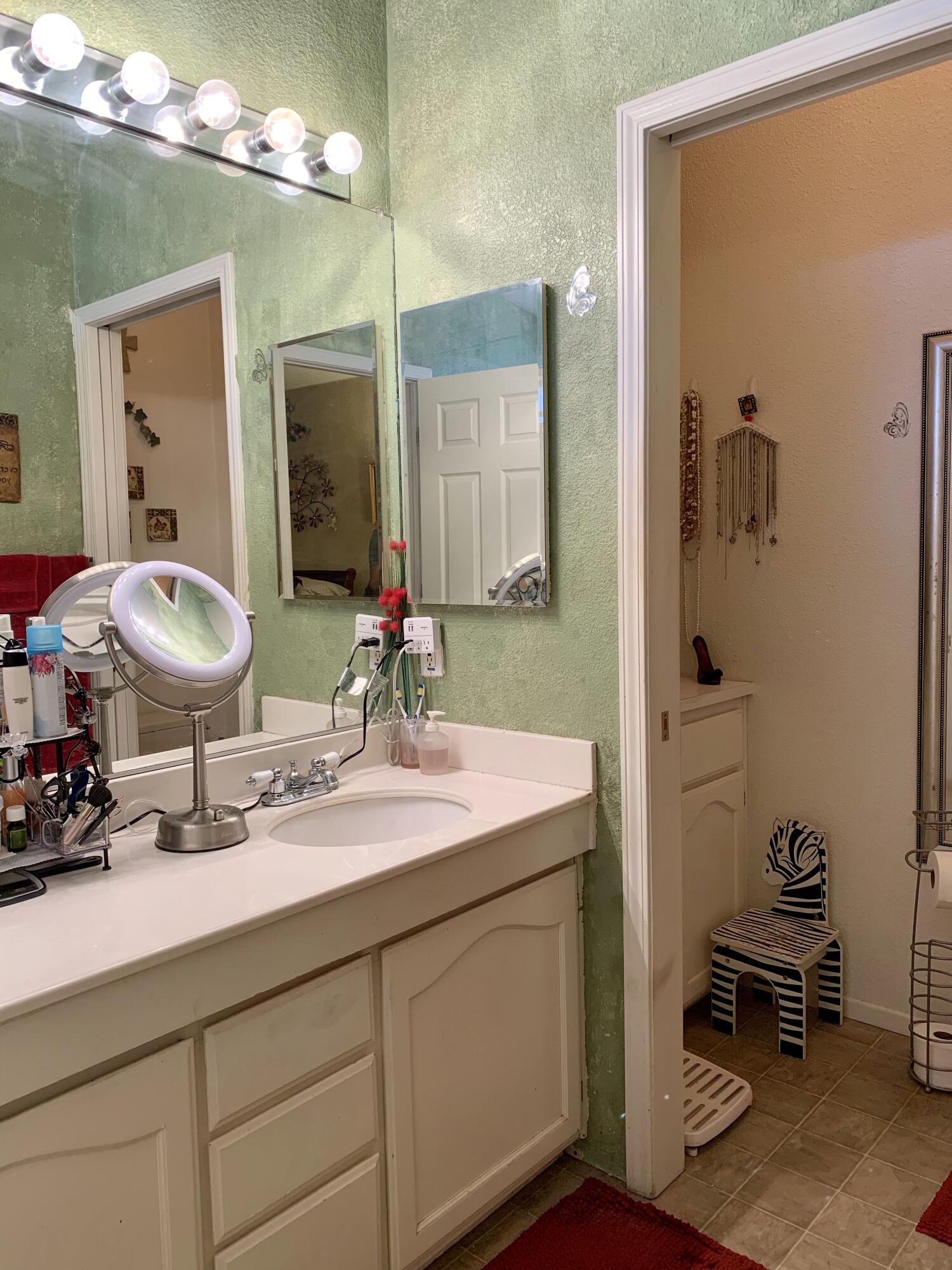 13310 Joshua Road Whitewater, CA 92282 - Photo 15 of 26 a bathroom with a sink double vanity and a mirror