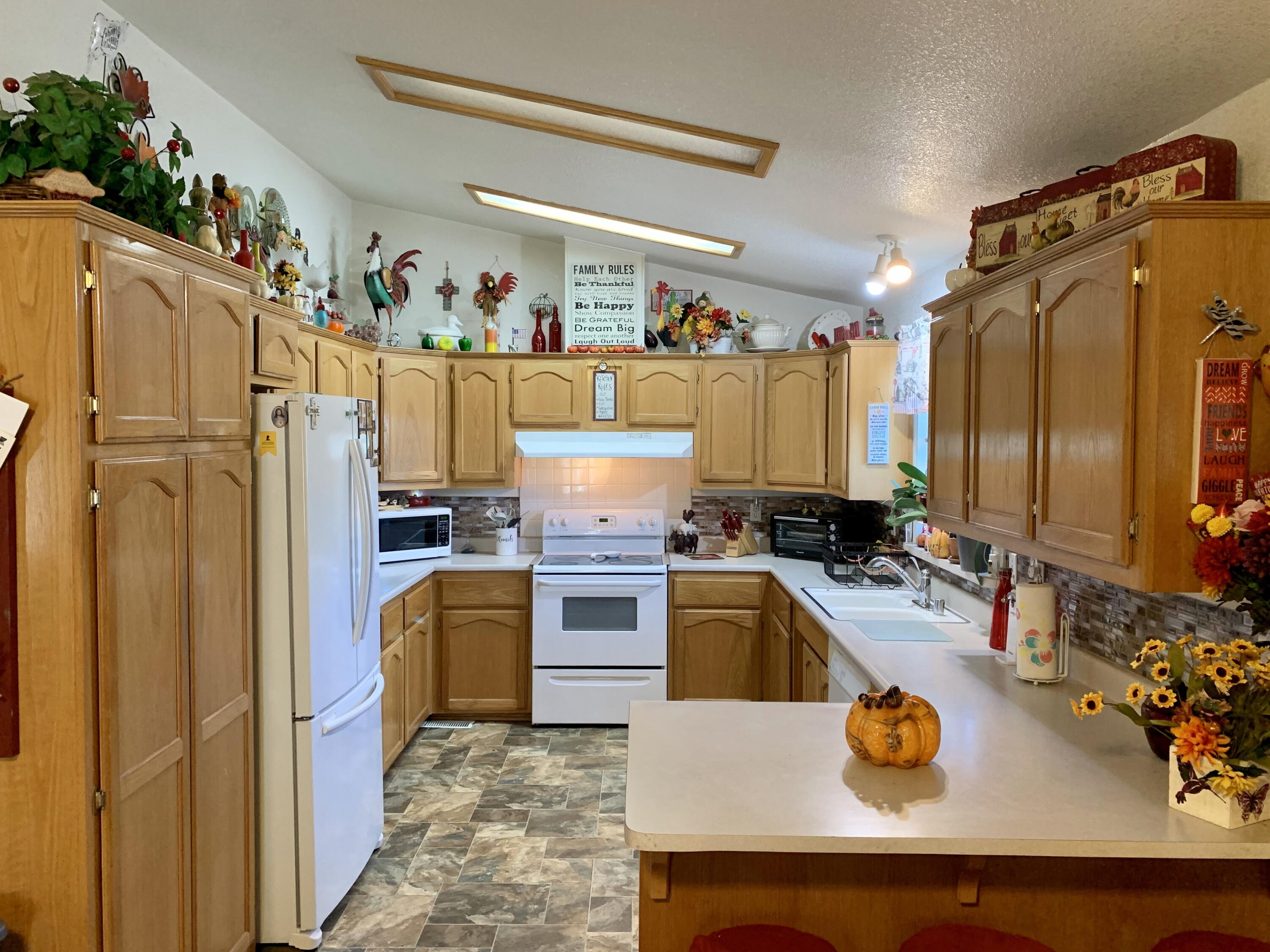 13310 Joshua Road Whitewater, CA 92282 - Photo 5 of 26 a kitchen with a refrigerator and a sink