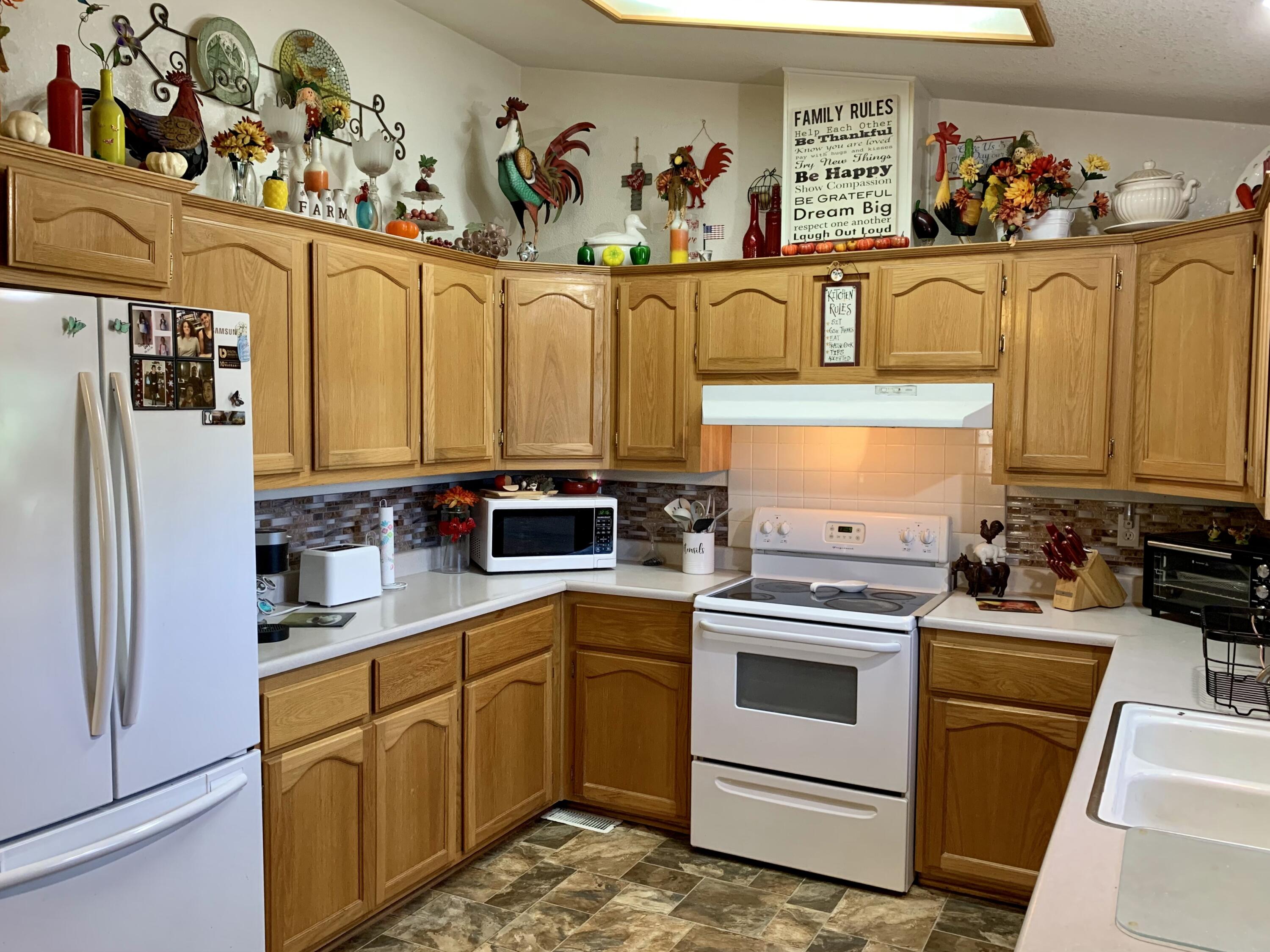 13310 Joshua Road Whitewater, CA 92282 - Photo 6 of 26 a kitchen with stainless steel appliances a stove a sink and cabinets
