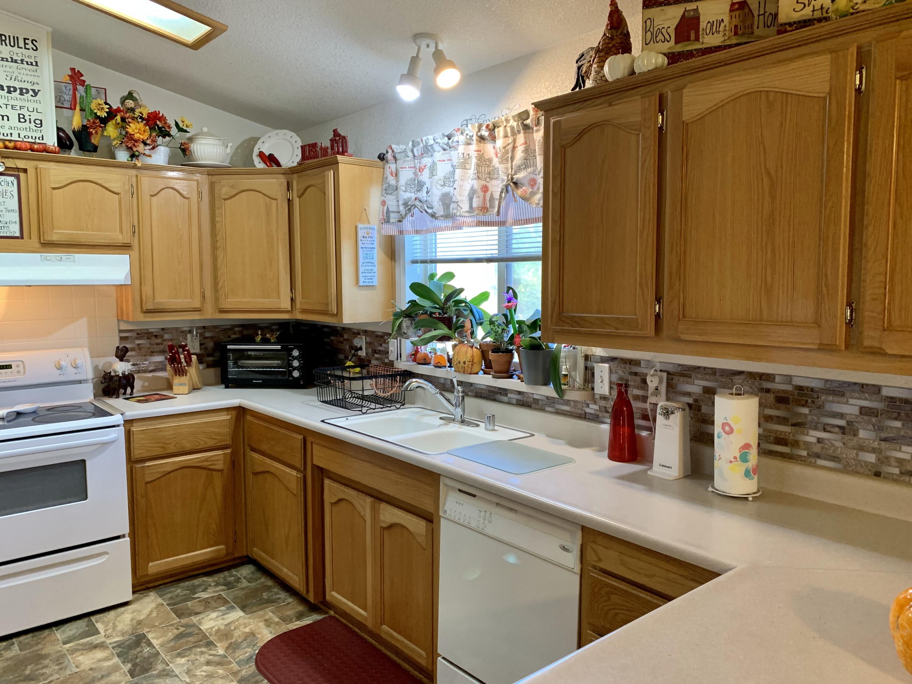 13310 Joshua Road Whitewater, CA 92282 - Photo 7 of 26 a kitchen with stainless steel appliances a sink a stove and a refrigerator