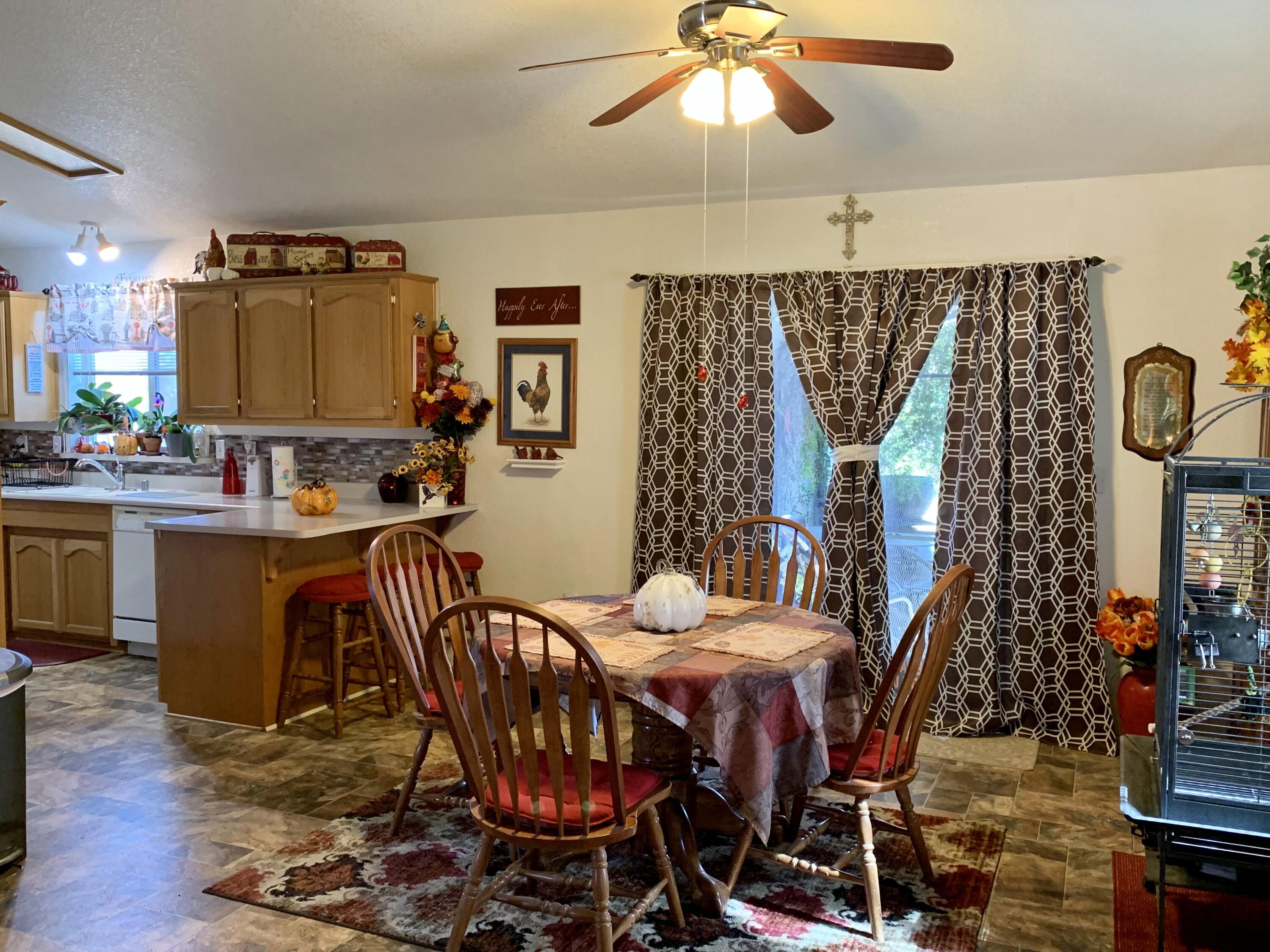13310 Joshua Road Whitewater, CA 92282 - Photo 8 of 26 a view of a dining room with furniture and chandelier