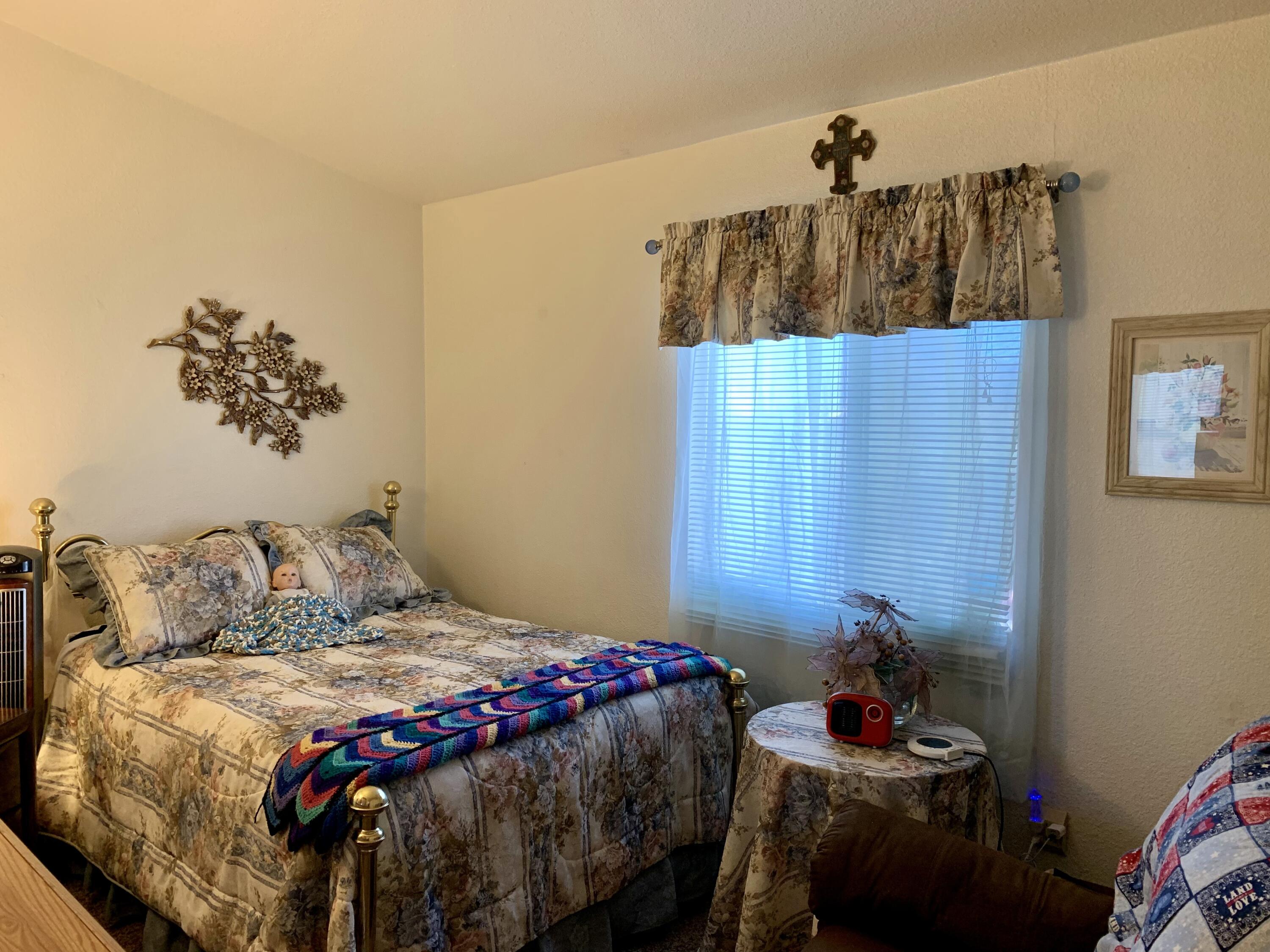 13310 Joshua Road Whitewater, CA 92282 - Photo 9 of 26 a bedroom with a bed and a window