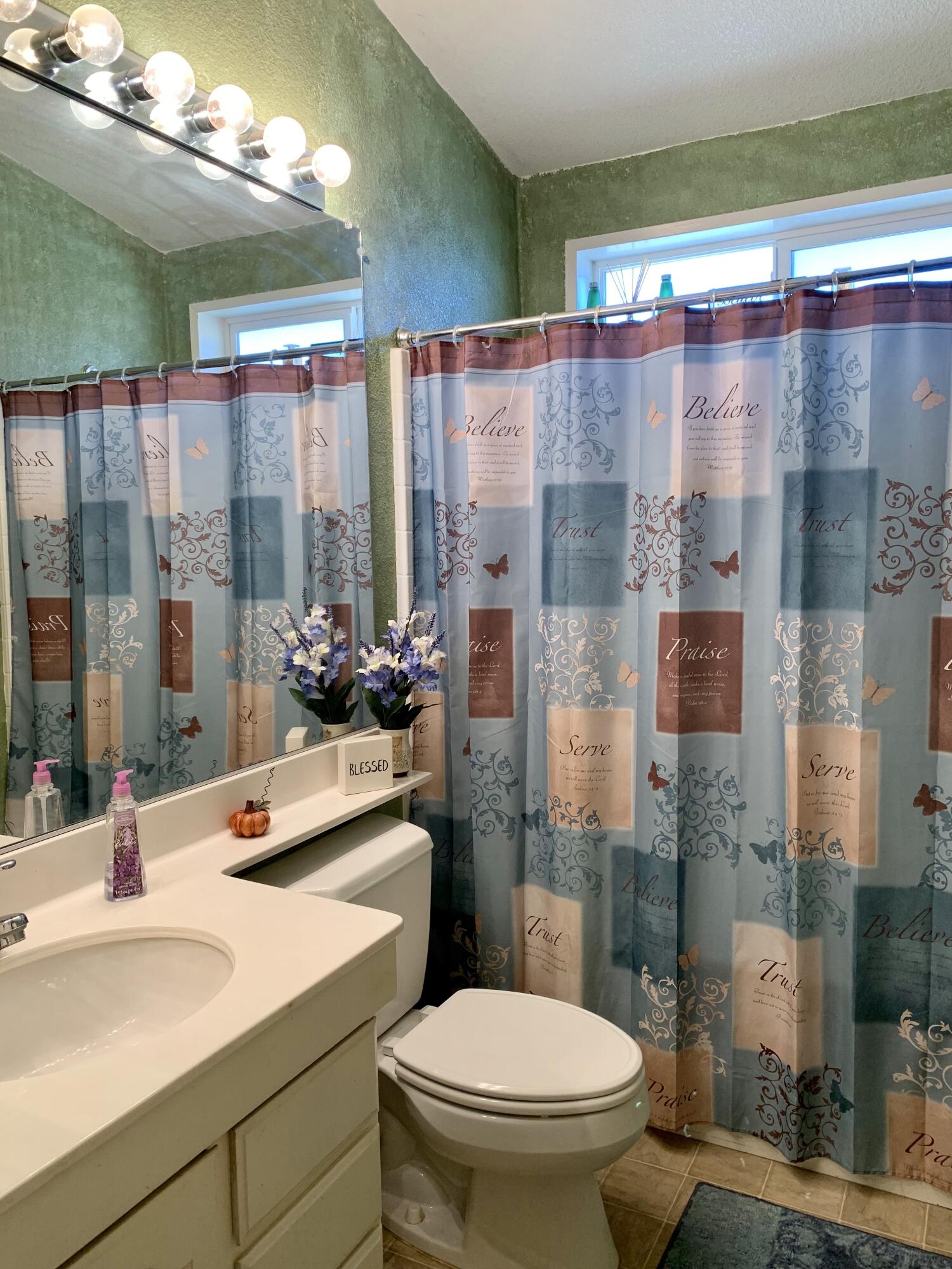 13310 Joshua Road Whitewater, CA 92282 - Photo 10 of 26 a bathroom with a sink and mirror with toilet