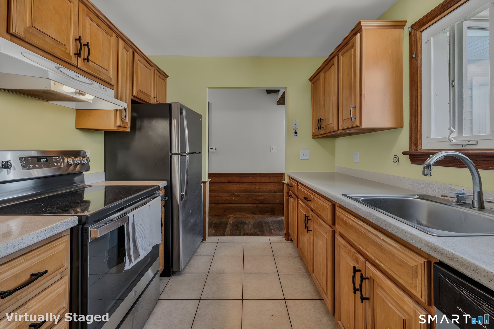 210 Shore Road Waterford, CT 06385 - Photo 21 of 26 a kitchen with a sink cabinets and stainless steel appliances