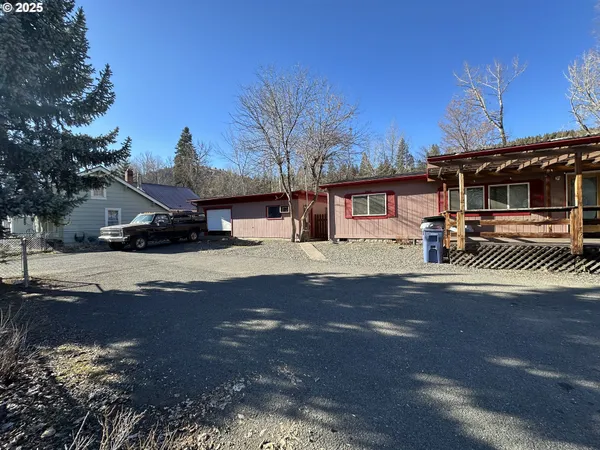 a view of outdoor space with deck and tree