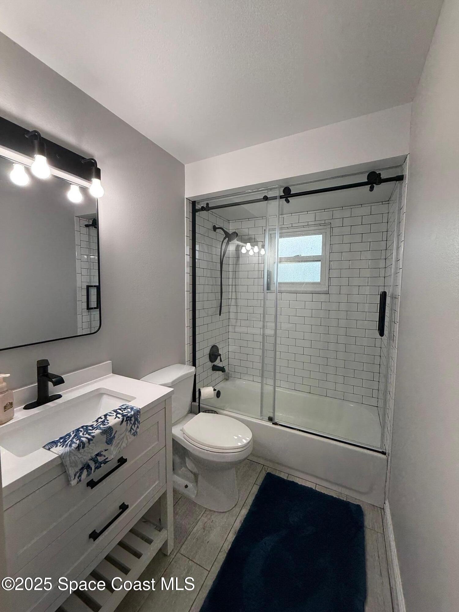 3816 Parapet Drive Cocoa, FL 32926 - Photo 17 of 32 a bathroom with a sink toilet and shower