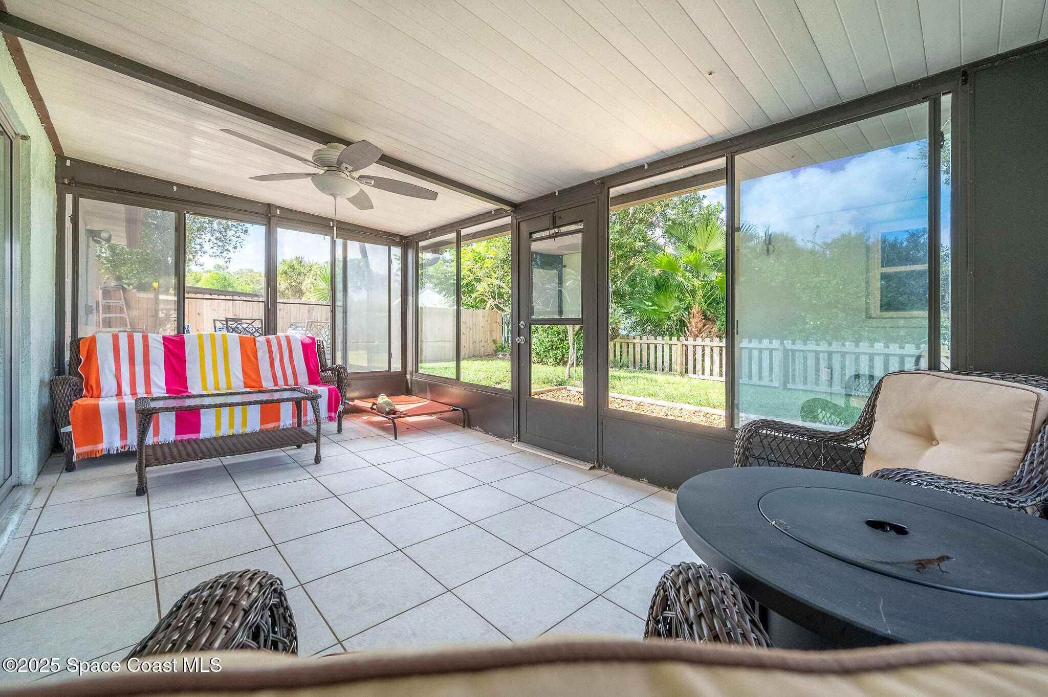3816 Parapet Drive Cocoa, FL 32926 - Photo 25 of 32 a living room with furniture and a large window with outer view