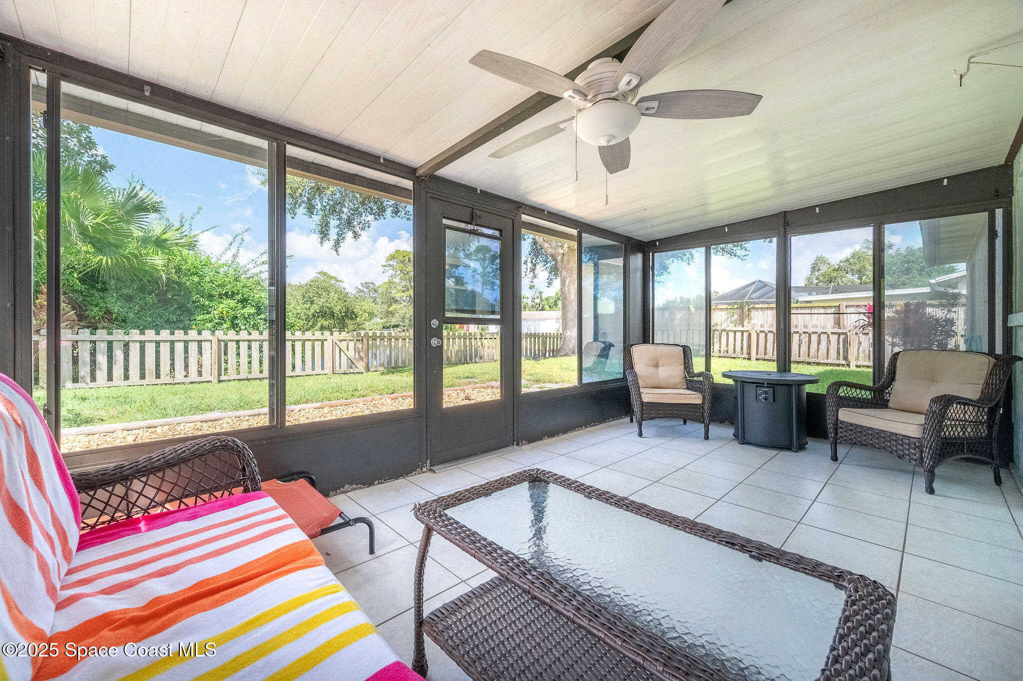 3816 Parapet Drive Cocoa, FL 32926 - Photo 27 of 32 a living room with furniture and a floor to ceiling window