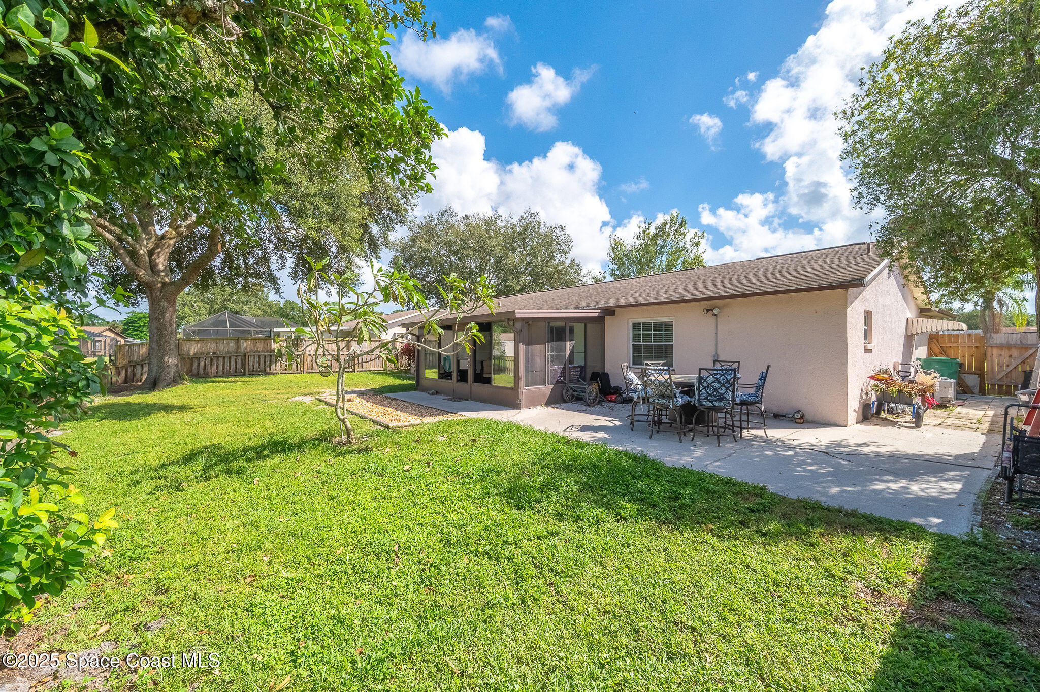 3816 Parapet Drive Cocoa, FL 32926 - Photo 28 of 32 a view of a house with backyard and sitting area