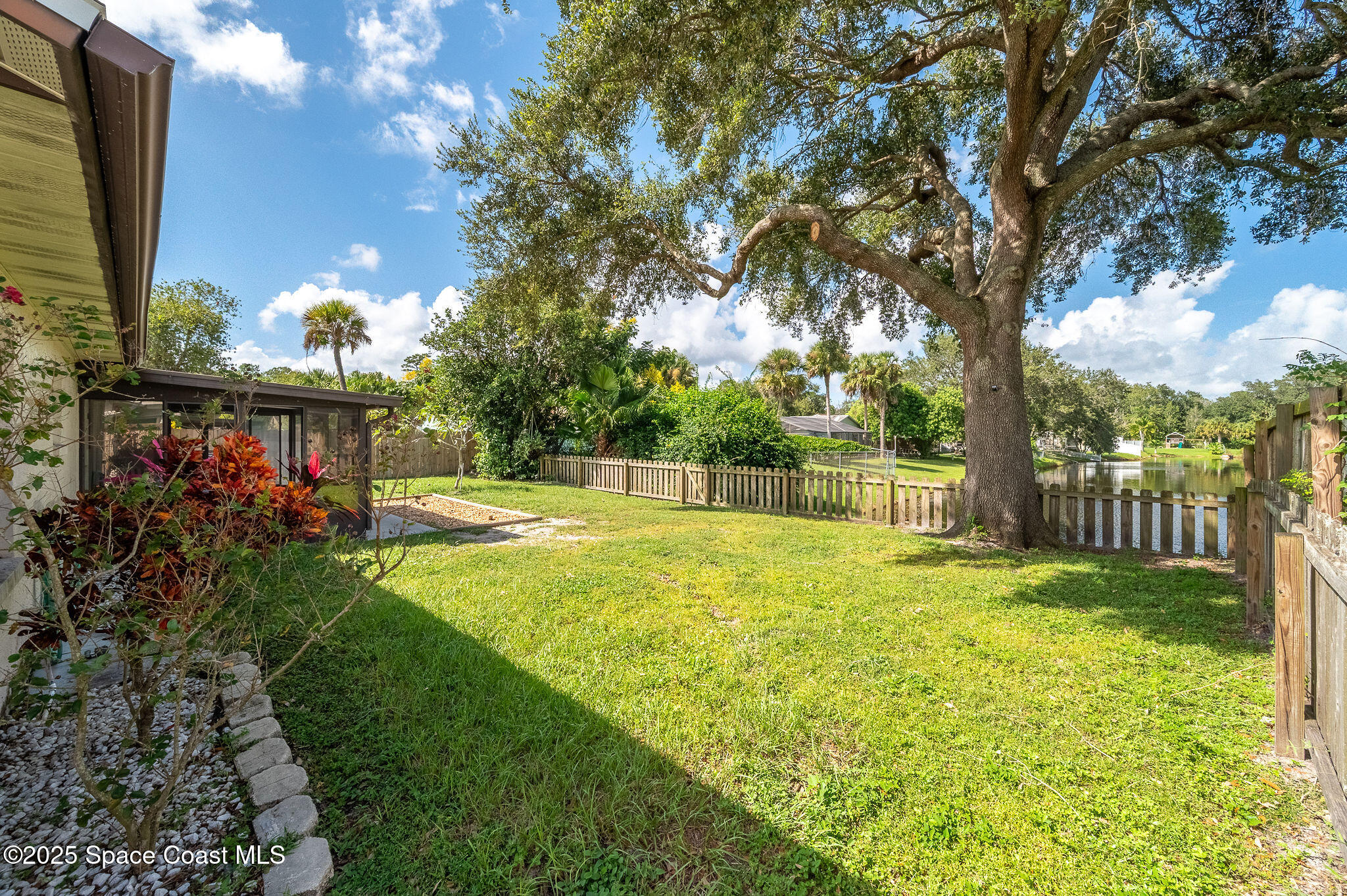 3816 Parapet Drive Cocoa, FL 32926 - Photo 30 of 32 a view of a house with a yard and basketball court