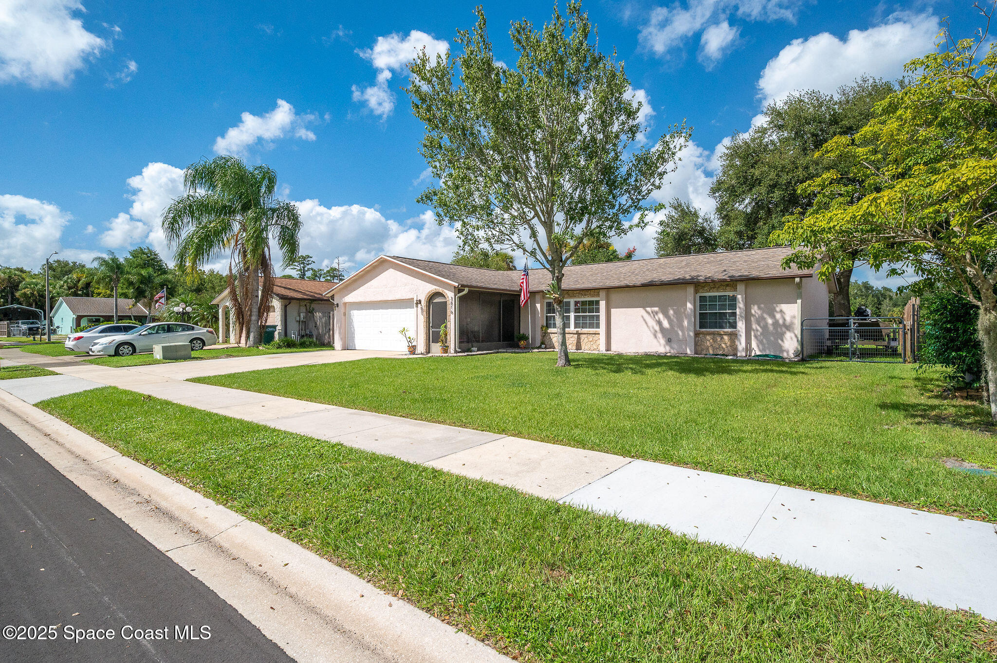 3816 Parapet Drive Cocoa, FL 32926 - Photo 32 of 32 a house with green field in front of it