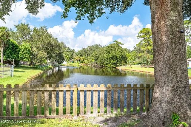 a living room with furniture window and wooden floor