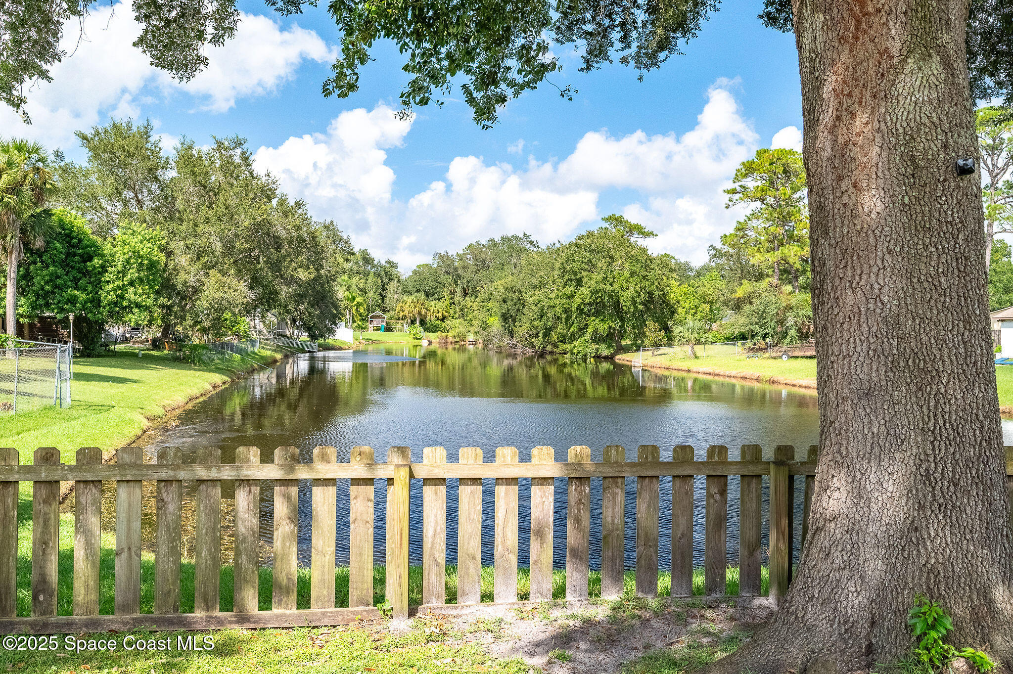 3816 Parapet Drive Cocoa, FL 32926 - Photo 4 of 32 a view of lake with a yard