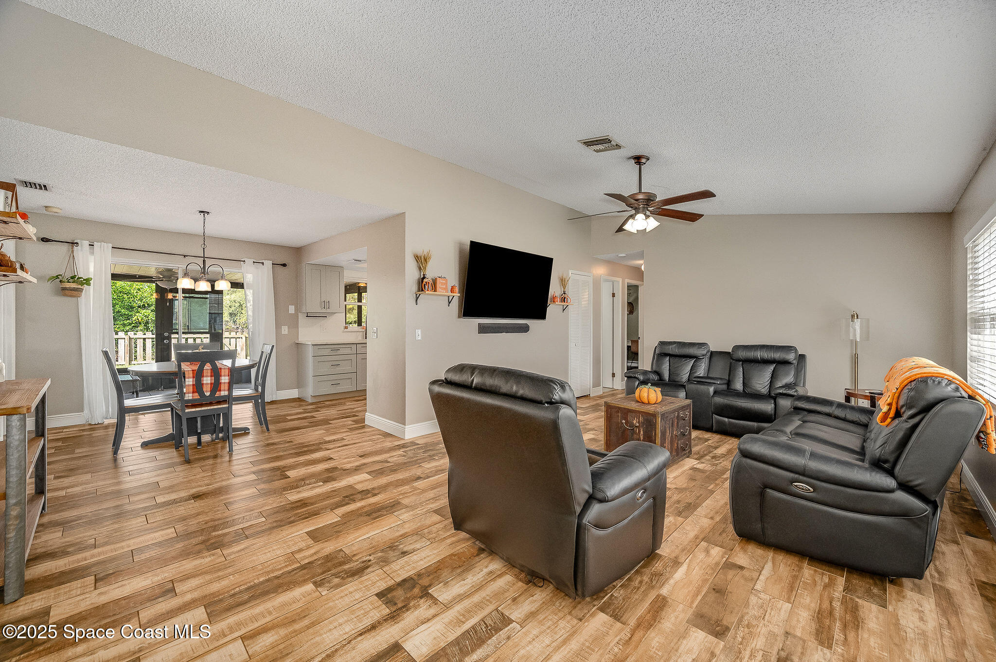 3816 Parapet Drive Cocoa, FL 32926 - Photo 5 of 32 a living room with furniture and a flat screen tv