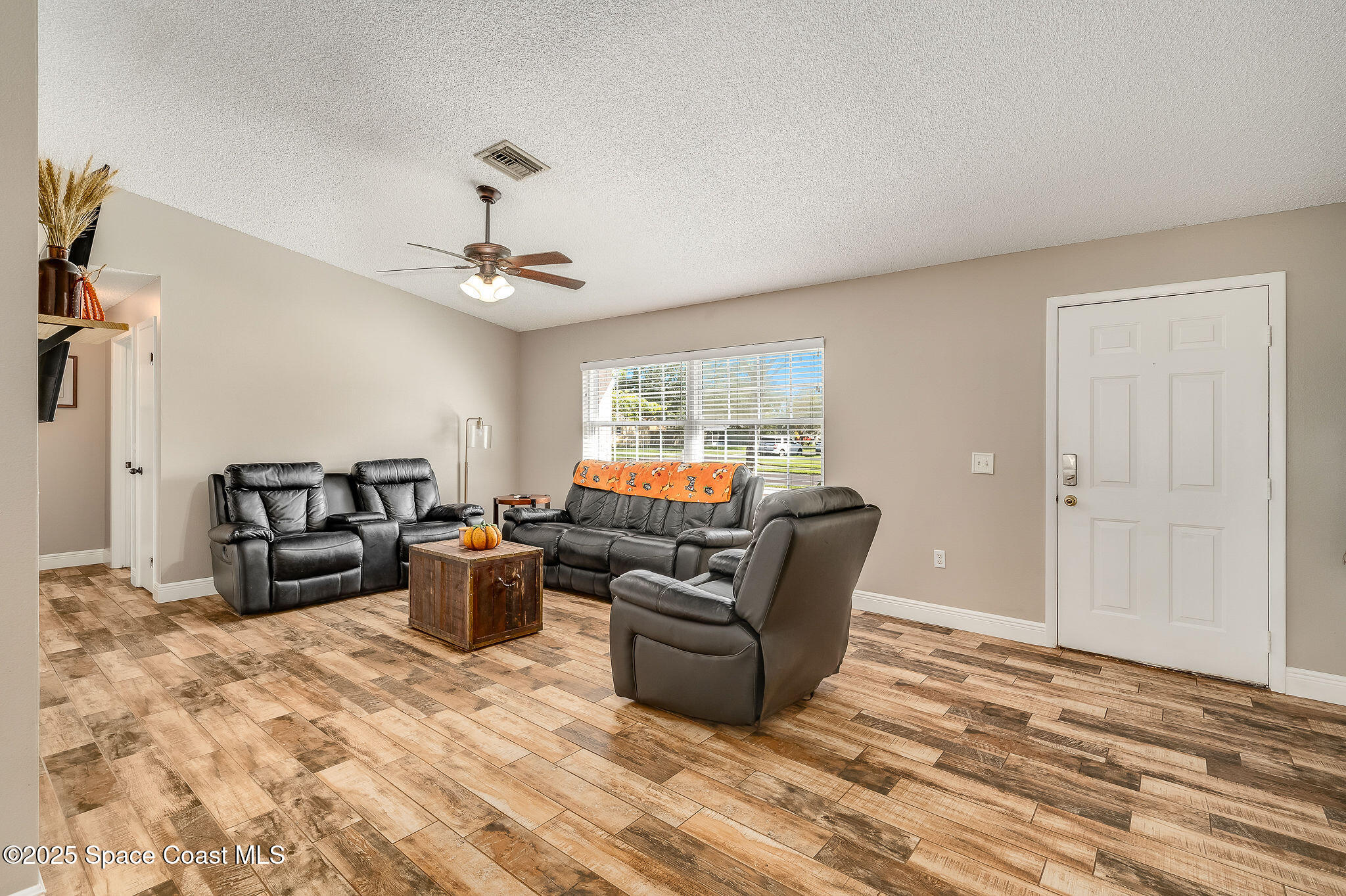 3816 Parapet Drive Cocoa, FL 32926 - Photo 6 of 32 a living room with furniture window and wooden floor
