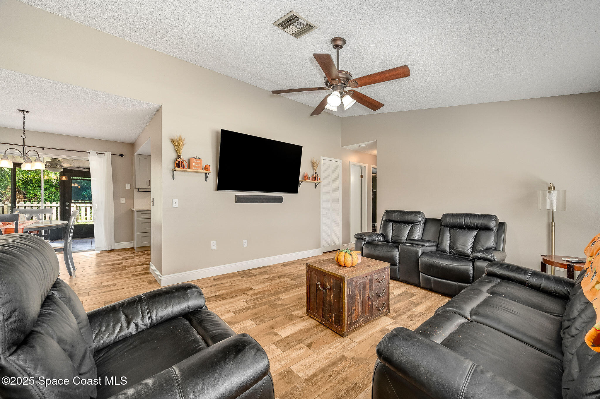 3816 Parapet Drive Cocoa, FL 32926 - Photo 7 of 32 a living room with furniture and a flat screen tv