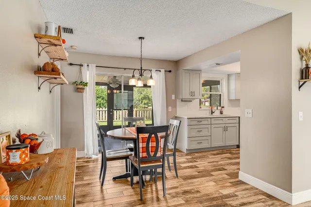 a kitchen with stainless steel appliances a stove refrigerator sink and microwave