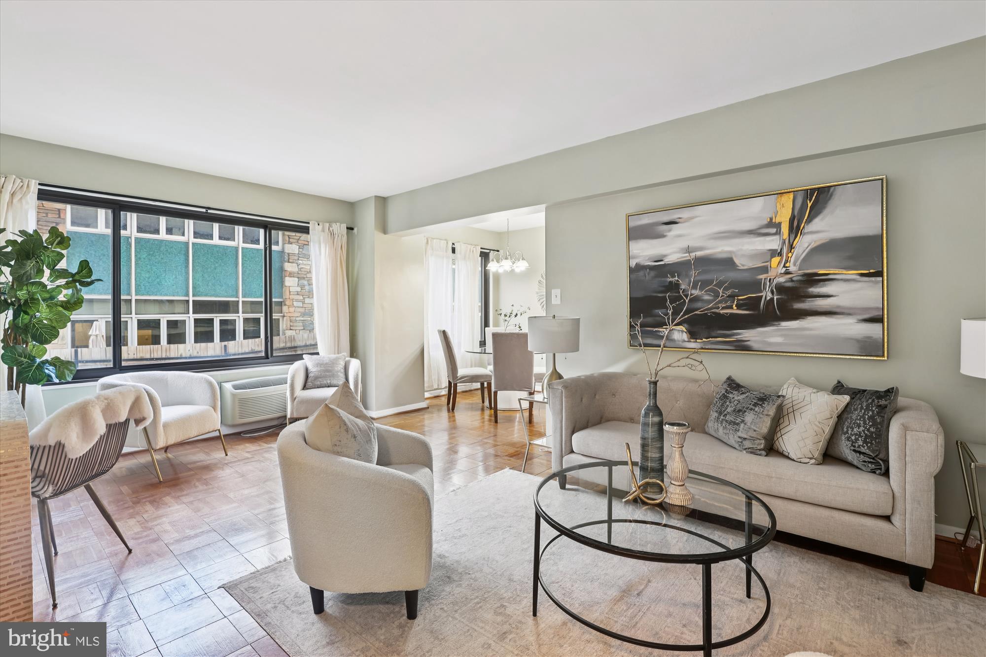 3601 Wisconsin Avenue Northwest, Unit 111 Washington, DC 20016 - Photo 11 of 21 a living room with furniture and a large window
