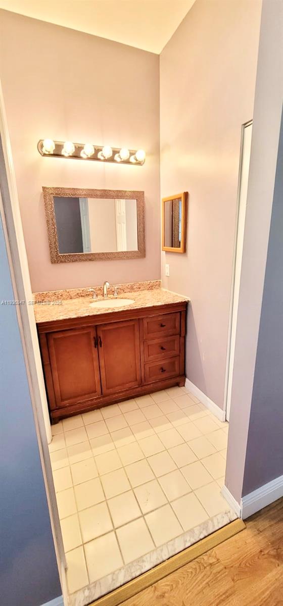 1005 Northeast 42nd Place Homestead, FL 33033 - Photo 16 of 20 a bathroom with a sink and a mirror