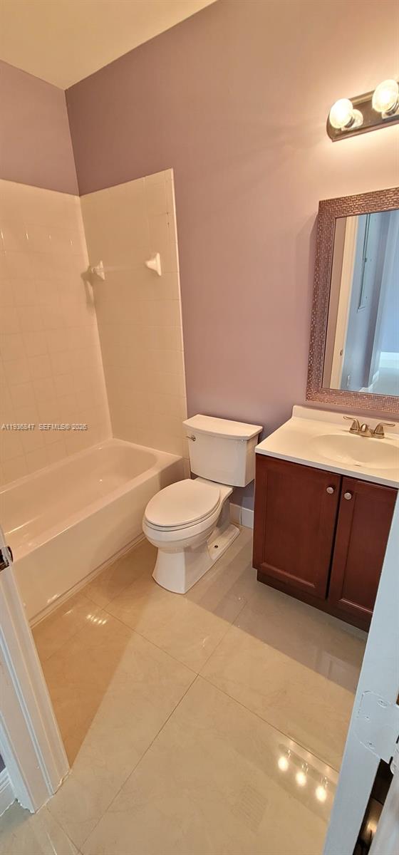 1005 Northeast 42nd Place Homestead, FL 33033 - Photo 17 of 20 a bathroom with a sink a toilet and shower