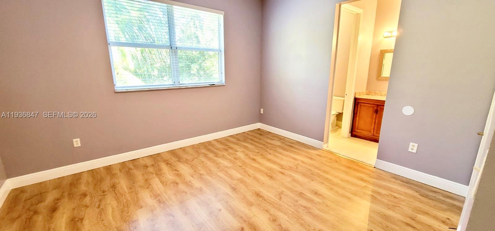 1005 Northeast 42nd Place Homestead, FL 33033 - Photo 10 of 20 a view of an empty room with a window