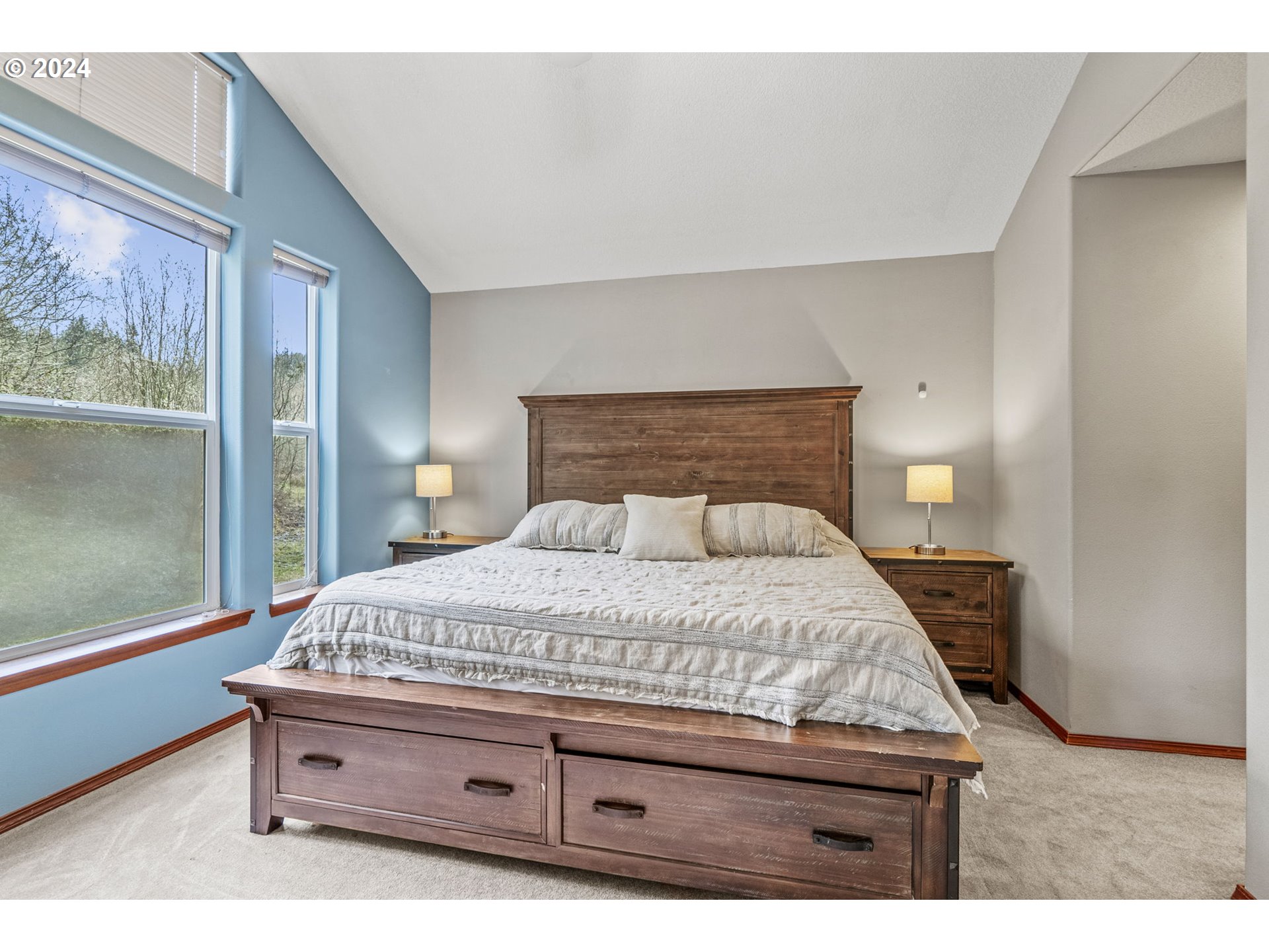 145 Ruby Court Kelso, WA 98626 - Photo 18 of 35 a bedroom with a bed and large window