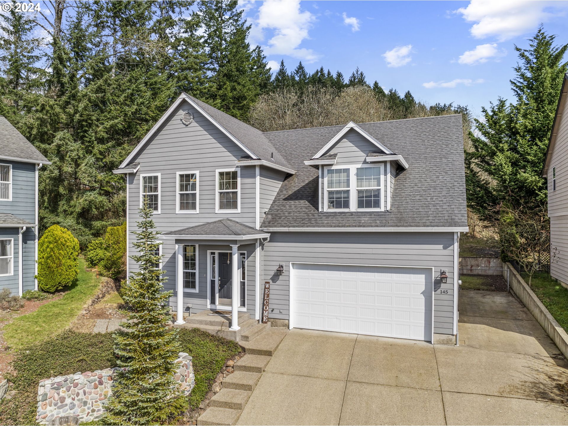 145 Ruby Court Kelso, WA 98626 - Photo 2 of 35 a front view of a house with a yard