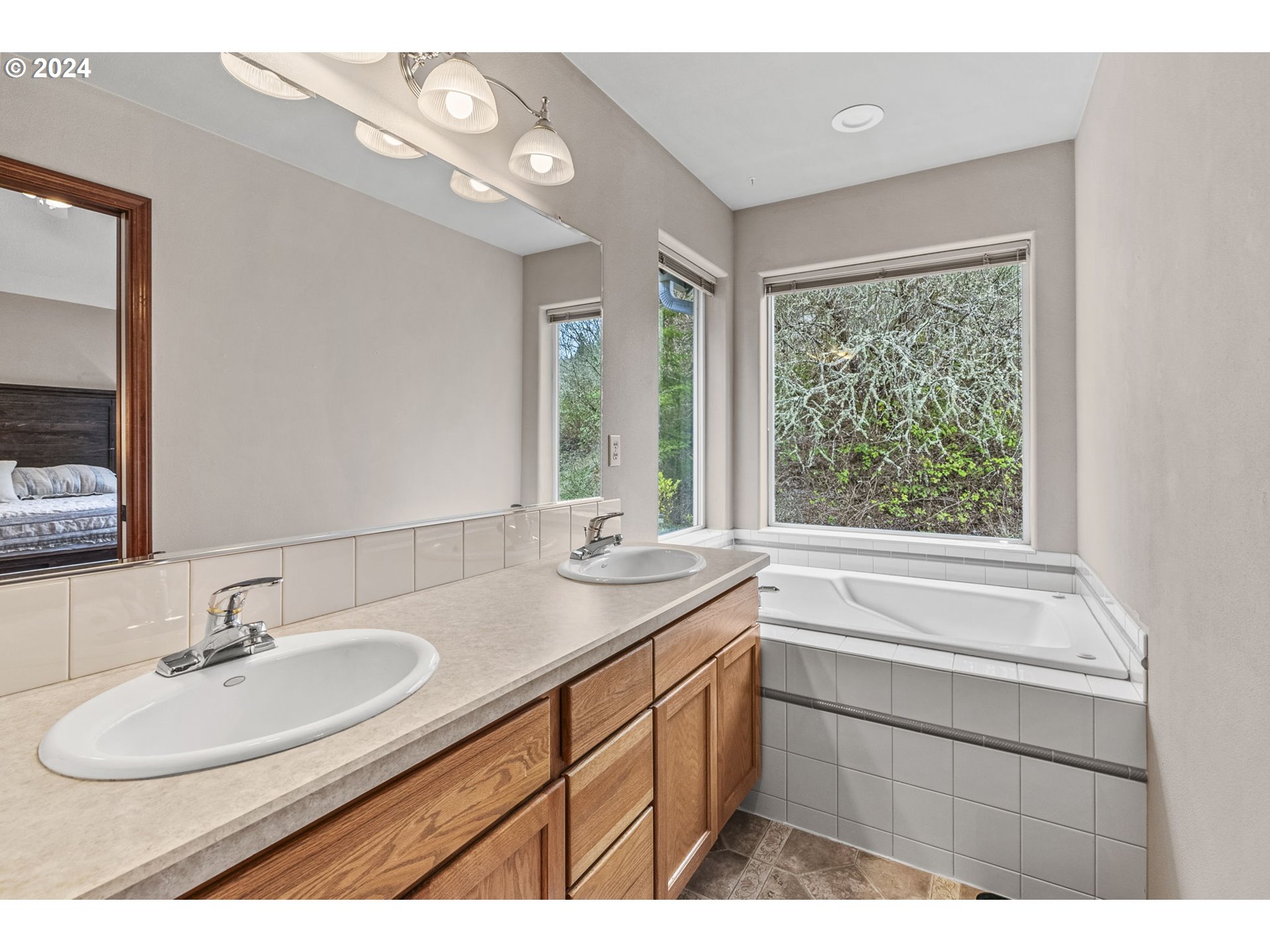 145 Ruby Court Kelso, WA 98626 - Photo 21 of 35 a bathroom with a sink double vanity and a mirror