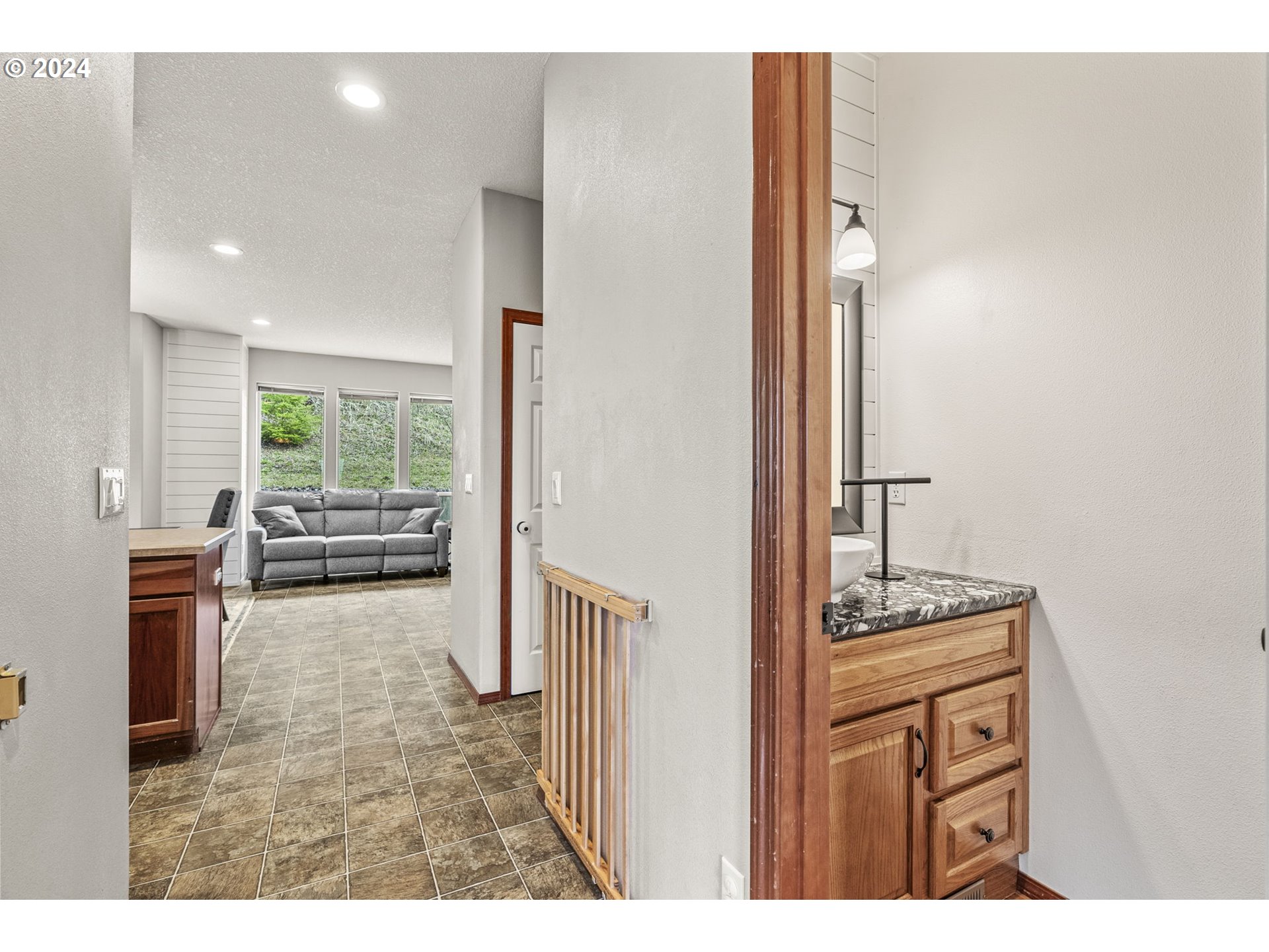 145 Ruby Court Kelso, WA 98626 - Photo 8 of 35 a bathroom with a granite countertop sink a toilet and a mirror